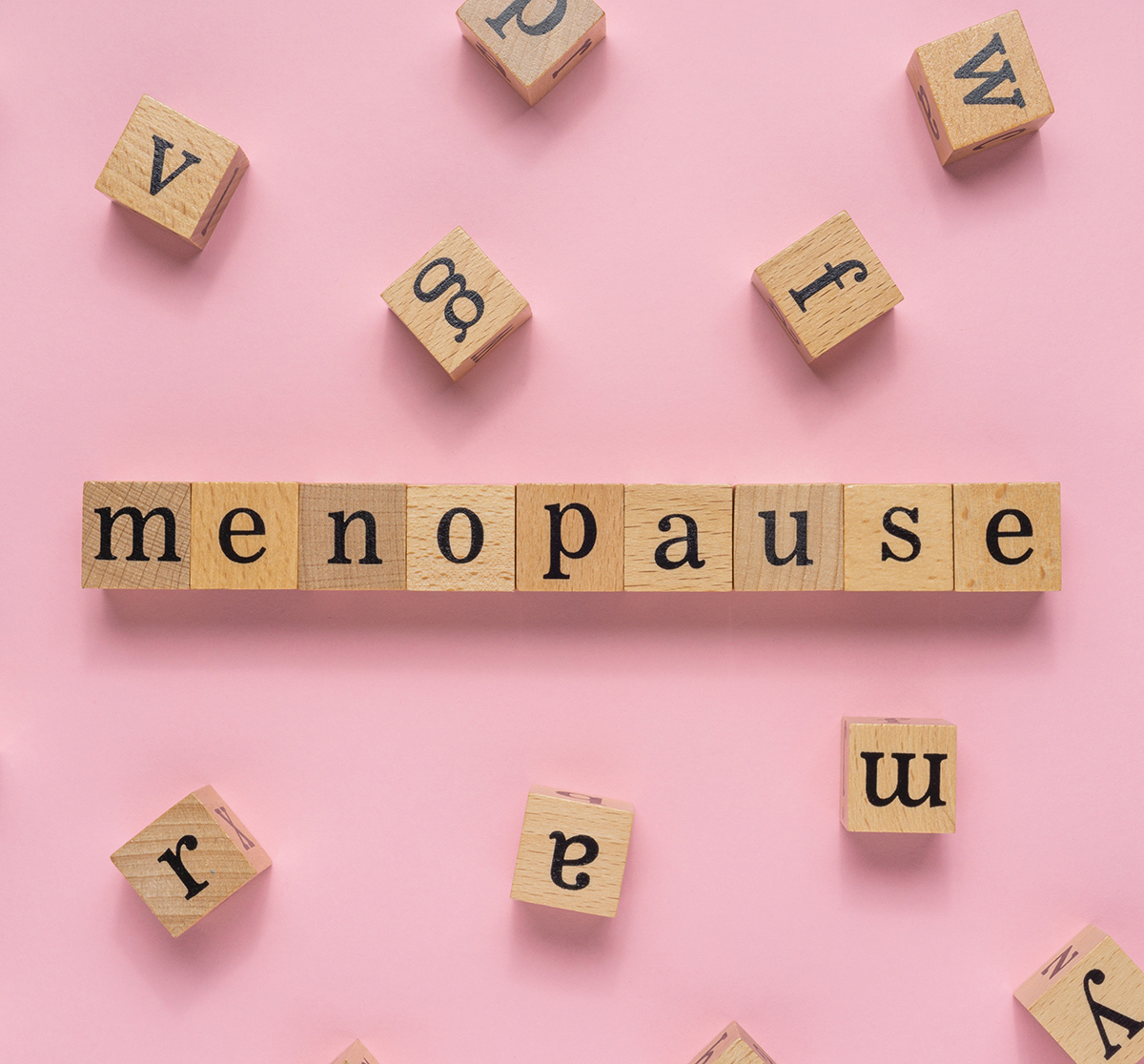 The word Menpause spelt out with wooden alphabet blocks